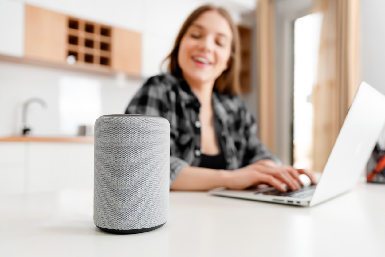 Woman using smart speaker